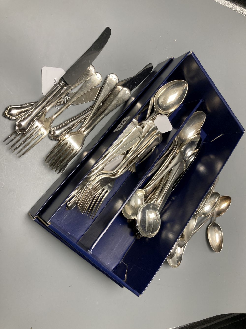 A silver Old English pattern tablespoon, 2.65oz and a quantity of plated and stainless steel flatware